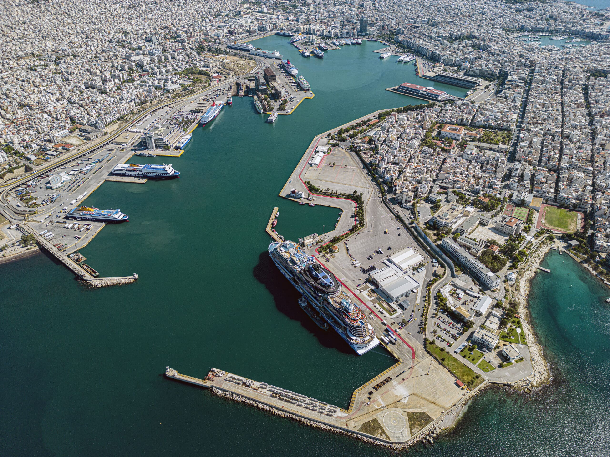Piraeus harbor cityscape, emphasizing the business community surrounding the Prassos Law office location.