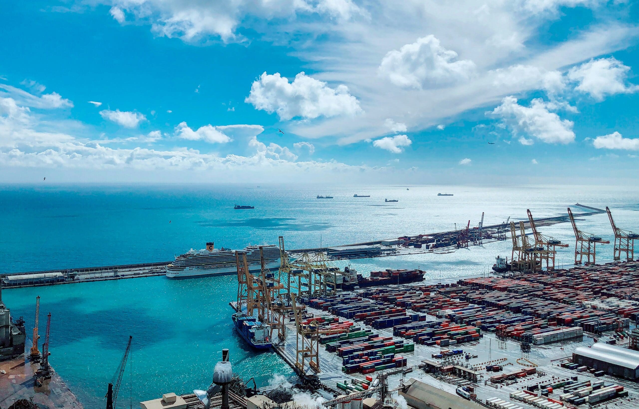 Aerial view of Piraeus harbor with container ships, symbolizing the heart of Greek shipping and commercial law.